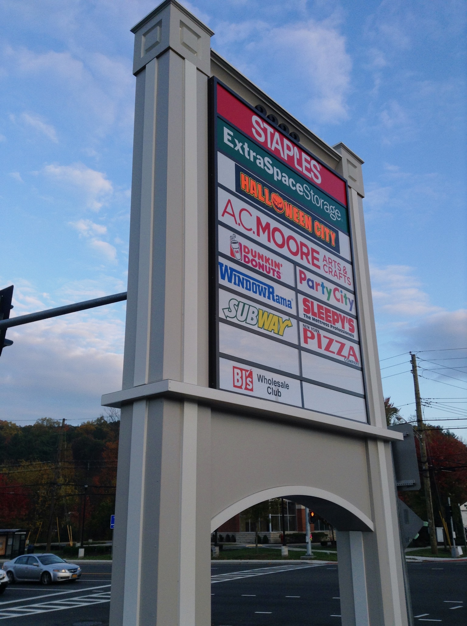 a tall store directory pylon for a shopping location